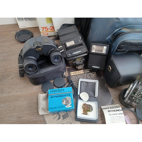 686 - A large collection of optical and camera equipment to include Nikon Nikomat EL 35mm SLR camera fitte... 