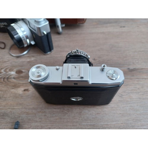 687 - A collection of optical and camera equipment to include cased Canon Canonet QL25 35mm rangefinder ca... 