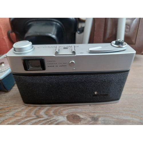 687 - A collection of optical and camera equipment to include cased Canon Canonet QL25 35mm rangefinder ca... 