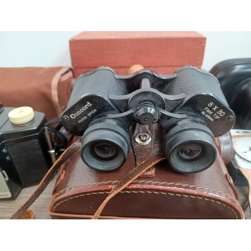 687 - A collection of optical and camera equipment to include cased Canon Canonet QL25 35mm rangefinder ca... 