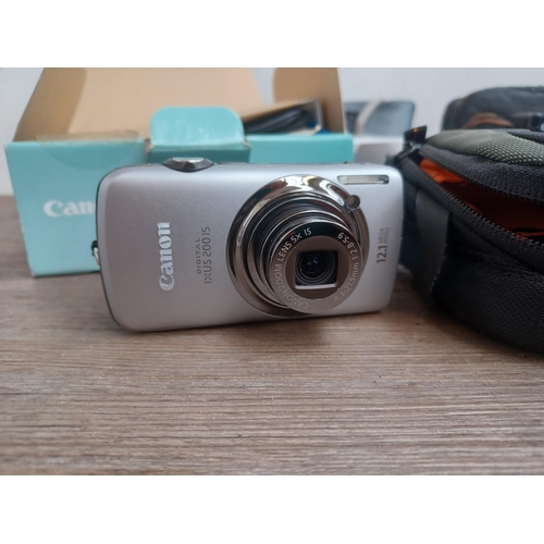 690 - A collection of Canon items to include boxed and cased IXUS 200 IS 12.1mp compact digital camera wit... 