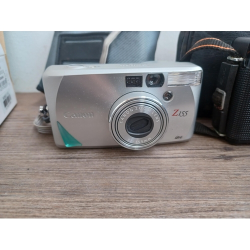 690 - A collection of Canon items to include boxed and cased IXUS 200 IS 12.1mp compact digital camera wit... 