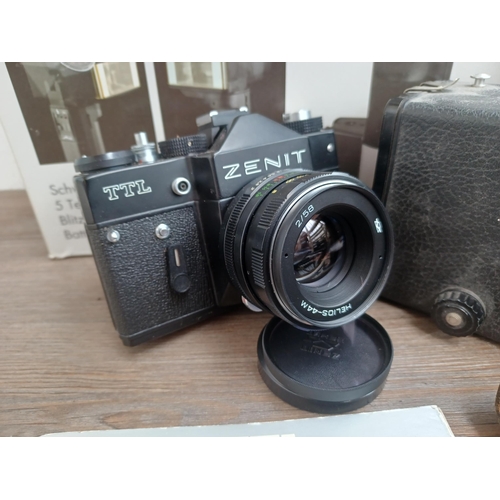 694 - A collection of cameras and photography equipment to include cased KMZ Zenit TTL 35mm SLR camera wit... 