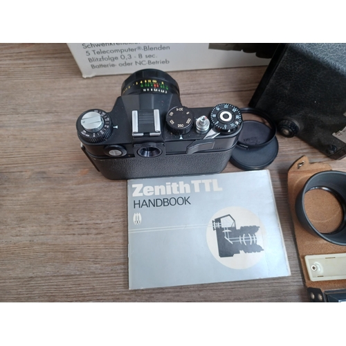 694 - A collection of cameras and photography equipment to include cased KMZ Zenit TTL 35mm SLR camera wit... 