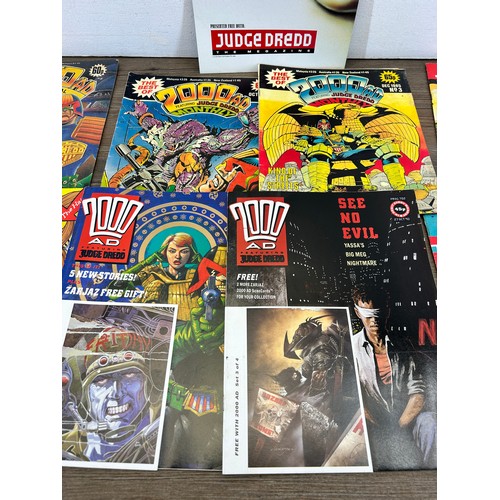 581 - A large collection of 2000 AD and Judge Dredd annuals, comics and magazines to include 2000 AD Octob... 