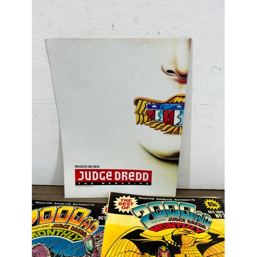 581 - A large collection of 2000 AD and Judge Dredd annuals, comics and magazines to include 2000 AD Octob... 