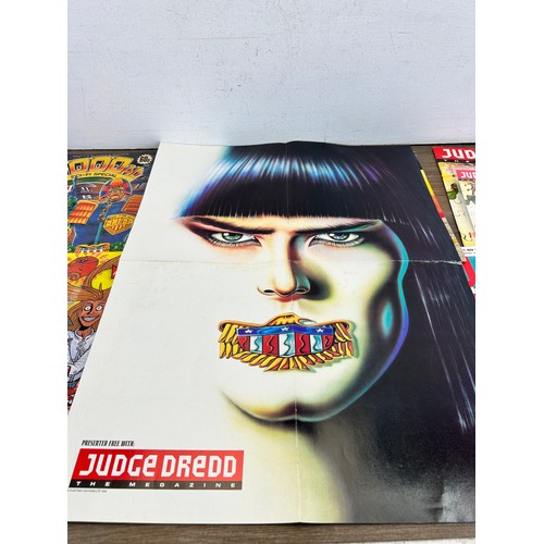 581 - A large collection of 2000 AD and Judge Dredd annuals, comics and magazines to include 2000 AD Octob... 