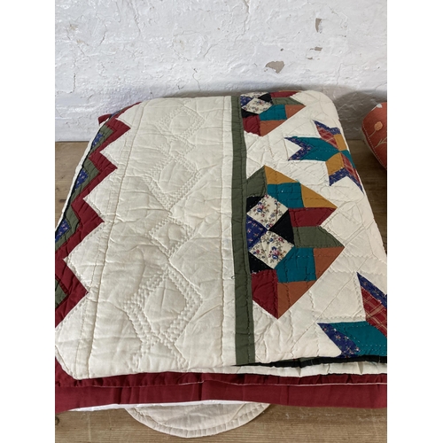 589 - A collection of quilts to include patchwork etc.