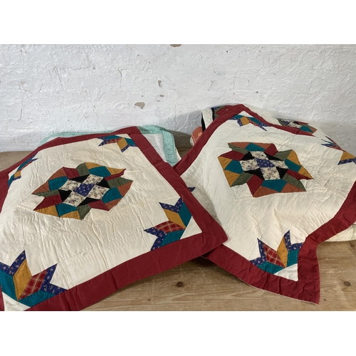 589 - A collection of quilts to include patchwork etc.