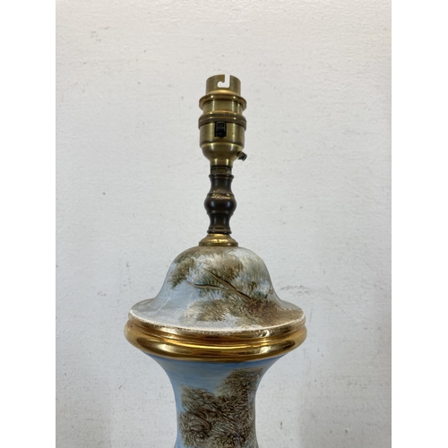 613 - A 19th century style hand painted porcelain table lamp on onyx base - approx. 60cm high