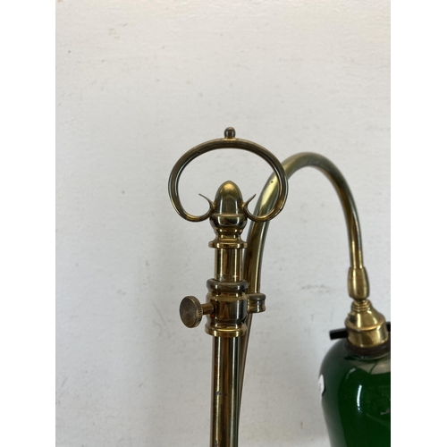 616 - A brass and green glass desk lamp - approx. 56cm high