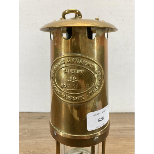 628 - An E. Thomas & Williams Ltd brass miner's lamp - approx. 26cm high