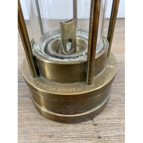 628 - An E. Thomas & Williams Ltd brass miner's lamp - approx. 26cm high