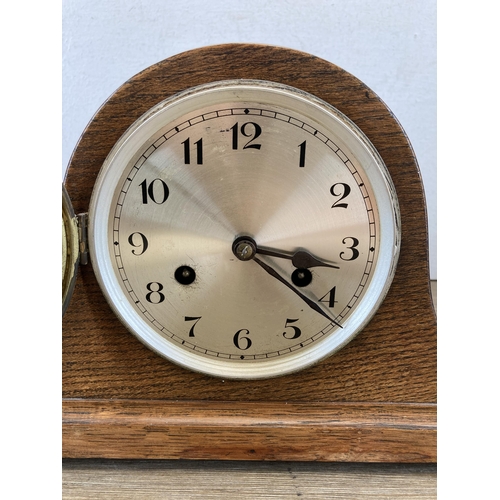 638 - An oak cased chiming mantel clock - approx. 21cm high x 30cm wide