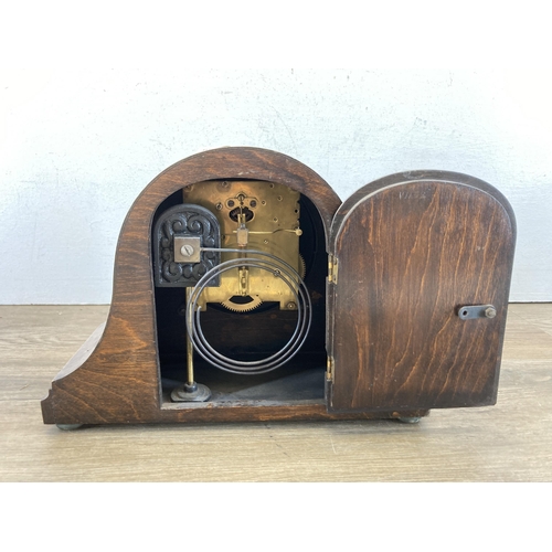 638 - An oak cased chiming mantel clock - approx. 21cm high x 30cm wide