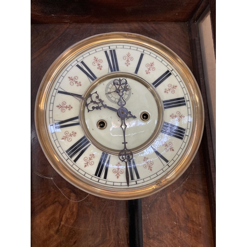 640 - A Victorian walnut cased Vienna wall clock with pendulum and weights - approx. 128cm high x 40cm wid... 