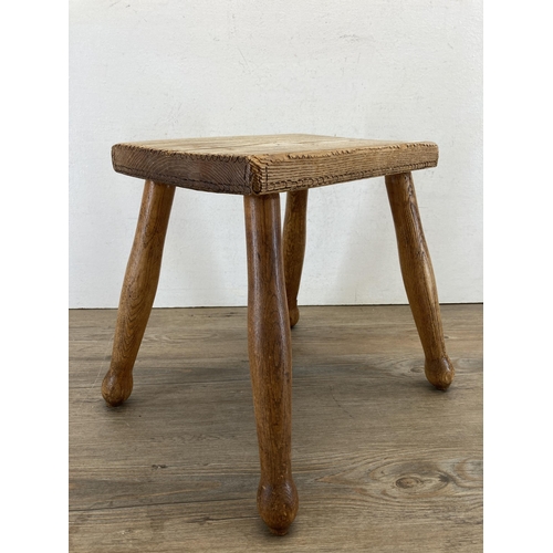 641 - An elm farmhouse stool - approx. 32cm high x 30cm wide x 21cm deep