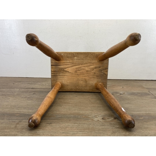 641 - An elm farmhouse stool - approx. 32cm high x 30cm wide x 21cm deep