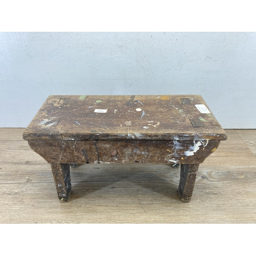 641A - An 19th century oak farmhouse stool - approx. 20cm high x 37cm wide x 17cm deep