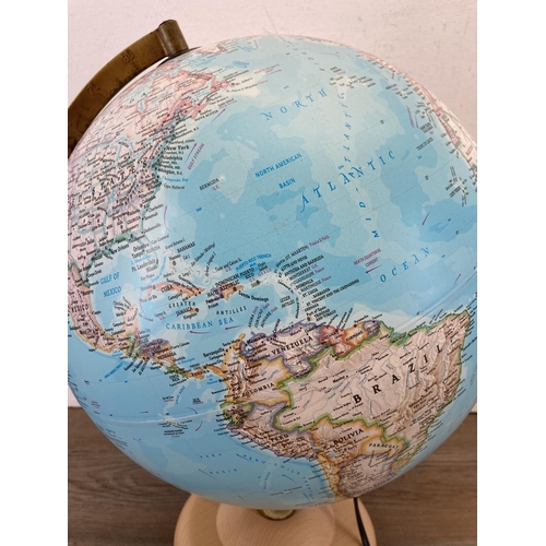 643 - An Atmosphere illuminating globe on beech stand - approx. 37cm high