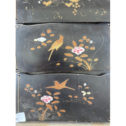 646 - An Oriental hand painted and black lacquered wall hanging letter rack - approx. 55cm high