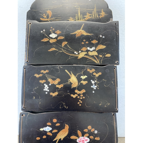 646 - An Oriental hand painted and black lacquered wall hanging letter rack - approx. 55cm high