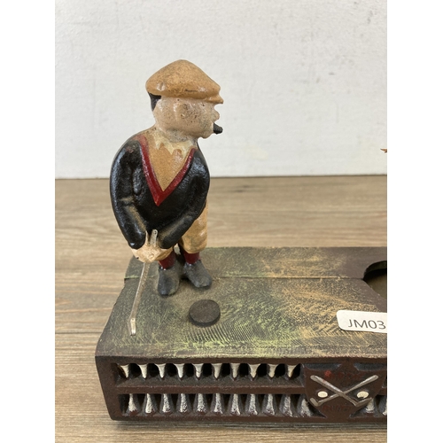 658 - A hand painted cast metal novelty golfing money box - approx. 16cm high x 21cm wide x 8cm deep