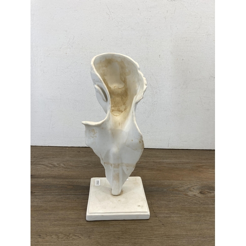 662 - A ceramic lady sculpture on plinth - approx. 31cm high