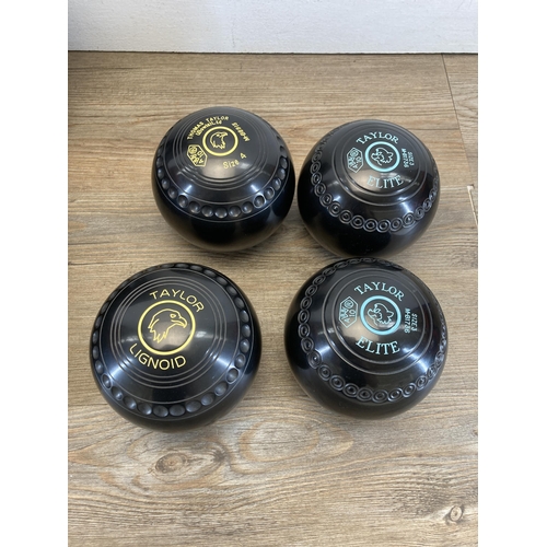 668 - A Taylor Bowls carry case containing four Taylor bowls