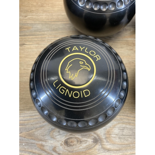 668 - A Taylor Bowls carry case containing four Taylor bowls