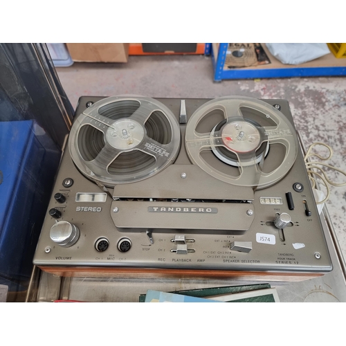 713 - A Tandberg Series 12 reel-to-reel tape recorder with instruction manual, boxed tapes and accessories