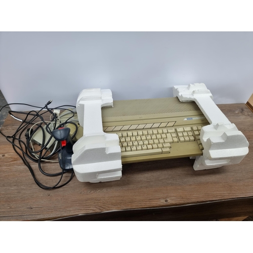 754 - A boxed Atari 520STFM personal home computer with joystick, mouse, cables, external 3.5