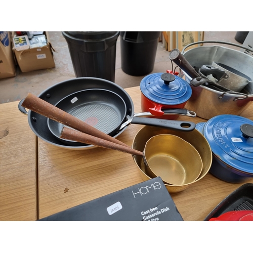 799 - A collection of kitchenware to include Le Creuset, Jamie Oliver Tefal griddle pan and frying pan, bo... 