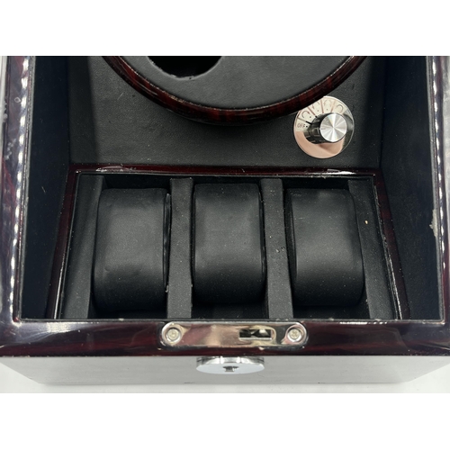 2158 - A rosewood effect 240v watch winder with capacity for five watches and battery slot to reverse