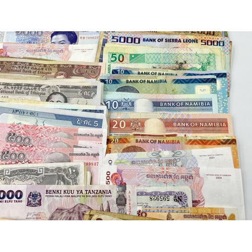 2273 - A collection of banknotes to include Central Bank of Tanzania, Central Bank of Syria, twelve Banco d... 