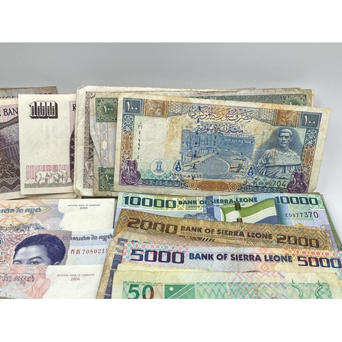 2273 - A collection of banknotes to include Central Bank of Tanzania, Central Bank of Syria, twelve Banco d... 