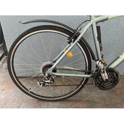 851 - A B'Twin Riverside hybrid bike with Shimano Acer 24 speed gear system