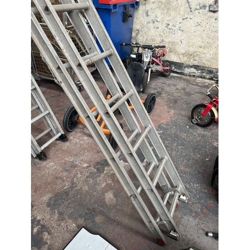 855 - Two pairs of aluminium extending ladders