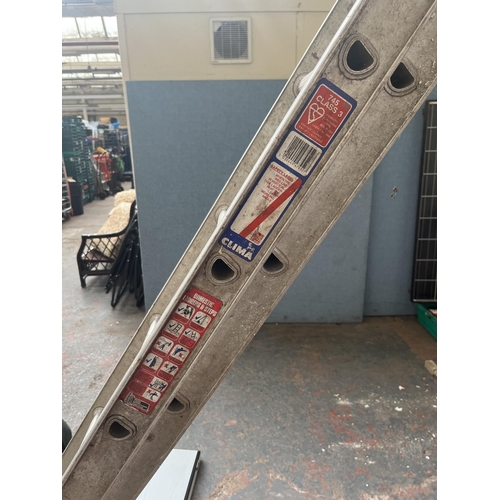 855 - Two pairs of aluminium extending ladders