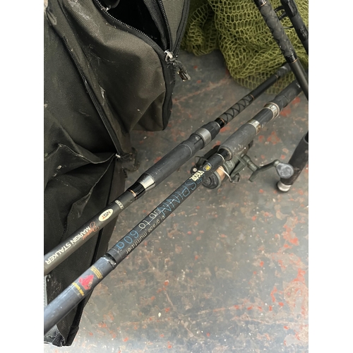 863 - A collection of fishing tackle to include Chubb seat box, five carp rods etc.