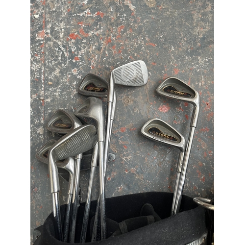 873 - Three pieces of golfing equipment, one Masterlite Caddy and two club bags containing clubs to includ... 