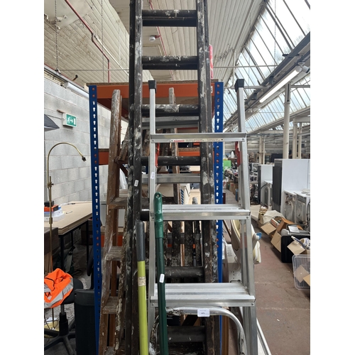 875 - A collection of DIY equipment to include six wooden and aluminium step ladders etc.