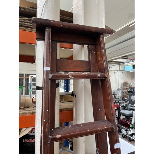 884 - A pair of wooden seven tread step ladders