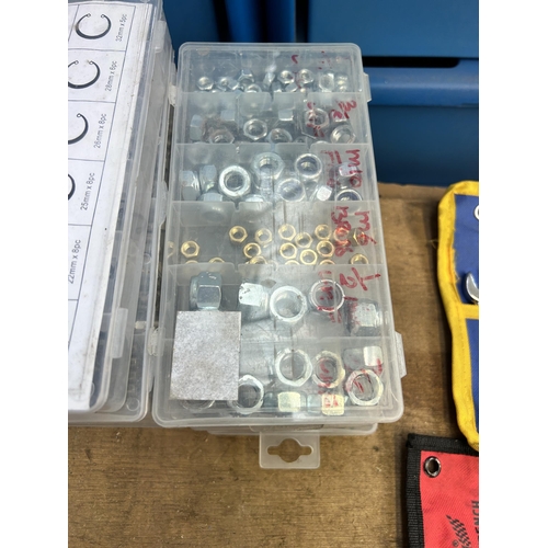 942 - Twelve cased set of nuts, bolts, washers, retaining rings and glass fuses