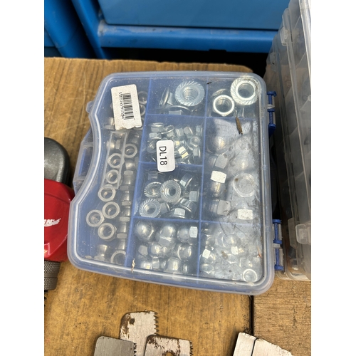 942 - Twelve cased set of nuts, bolts, washers, retaining rings and glass fuses