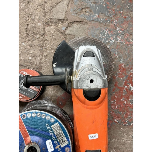 956 - A Silverline 240v angle grinder with disks to include 180mm grinding disks, 115mm cutting disks etc.