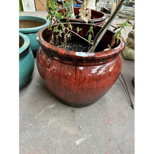 1000 - A pair of large glazed terracotta planters