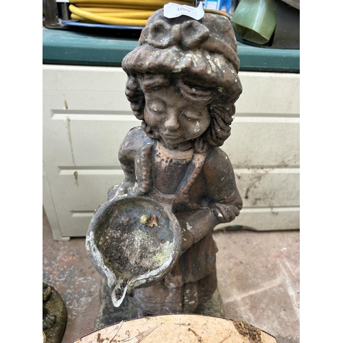 1009 - Two items, one cast stone garden ornament in the form of a young girl together with vintage metal po... 