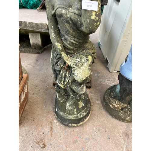 1011 - A cast stone figural garden ornament in the form of a robed lady