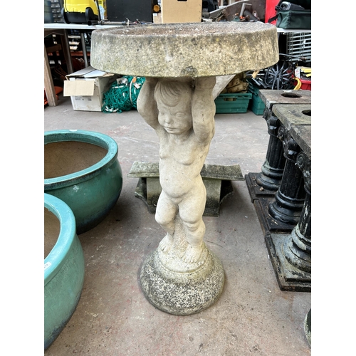 1012 - Four garden items, three terracotta rectangular planters and one cast stone bird bath on cherub desi... 